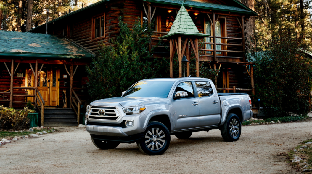 Toyota Tacoma in front of a barn
